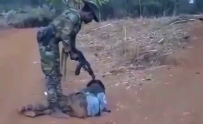 ENDF soldier executing a captured OLA fighter