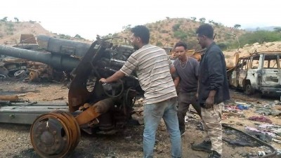 TDF with a damaged D-30 howitzer amidst the remains of a convoy