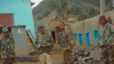 Eritrean soldiers are captured on a hidden camera by CNN at a checkpoint in the hills above Adigrat, as they block access to the road to Axum.